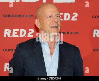 Munich, Germany. 24th July, 2013. US actor Bruce Willis poses for the camera during a photocall for his new film 'R.E.D.2' at Hotel Manadrin Oriental in Munich, Germany, 24 July 2013. The film is featured in German cinemas on 12 September 2013. Photo: Ursula Dueren/dpa/Alamy Live News Stock Photo