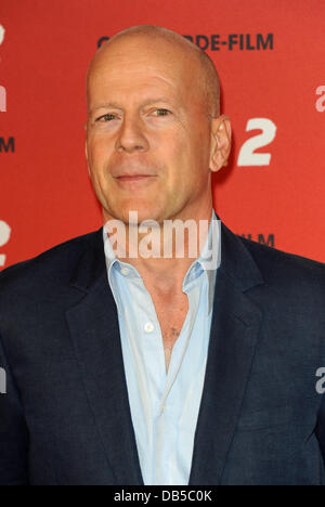 Munich, Germany. 24th July, 2013. US actor Bruce Willis poses for the camera during a photocall for his new film 'R.E.D.2' at Hotel Manadrin Oriental in Munich, Germany, 24 July 2013. The film is featured in German cinemas on 12 September 2013. Photo: Ursula Dueren/dpa/Alamy Live News Stock Photo