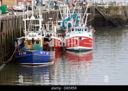 Trawlers in Whitby harbour, Whitby, North Yorkshire, England, UK. Stock Photo