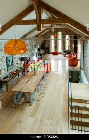 18th century Devon long barn conversion with mezzanine floor furnished with an eclectic mix Stock Photo