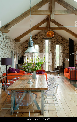 18th century Devon long barn conversion with mezzanine floor furnished with an eclectic mix Stock Photo