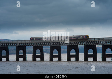 First Scotrail train crossing the iconic Tay Rail Bridge spanning the Firth of Tay, Scotland. Stock Photo