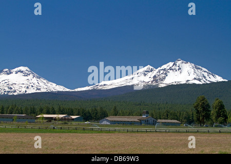 Three sisters mountains along U.S. Route 20 at Sisters, Oregon, USA. Stock Photo