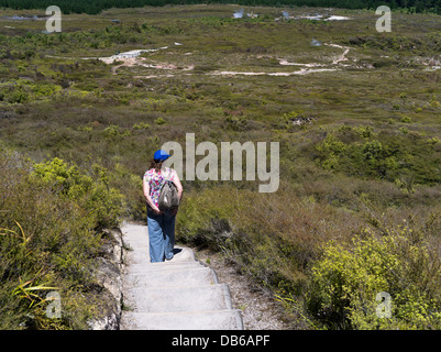 dh Craters of the Moon TAUPO NEW ZEALAND Woman tourist Geothermal Walk thermal landscape steam vents crater people Stock Photo
