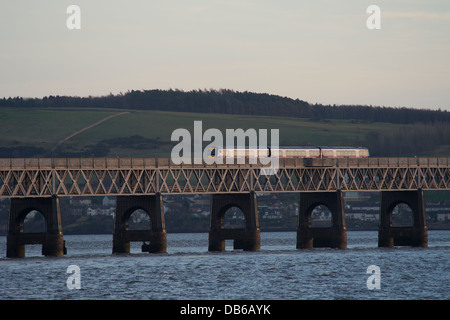 First Scotrail train crossing the iconic Tay Rail Bridge spanning the Firth of Tay, Scotland. Stock Photo