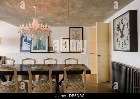 Islamic art with Arabesque shapes in dining room with 'Ruban' chairs by Philippe Hurel, interior design by David Carter Stock Photo