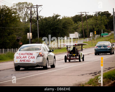 Not a fast race. High school students driving solar powered cars they built, following the sun with hopes to get from Texas to California in 8 days. The Solar Car Challenge started 20 years ago to motivate students in the sciences, engineering, and technology Stock Photo