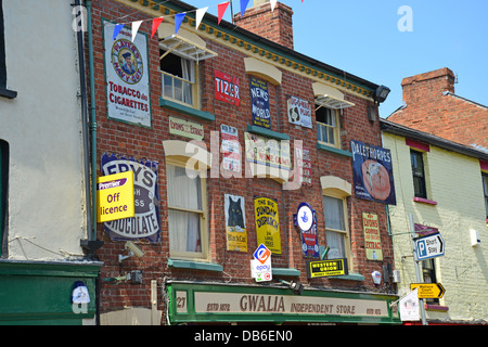Retro enamel tin metal advertising signs on front of shop, Broad Street, Ross-on-Wye, Herefordshire, England, United Kingdom Stock Photo