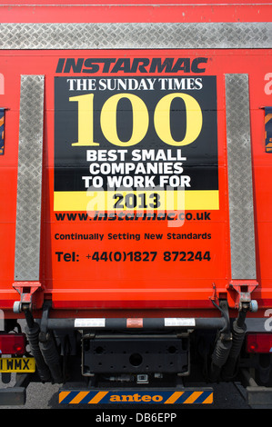 Sunday Times 100 best small companies to work for poster on the back of an Instarmac lorry UK Stock Photo