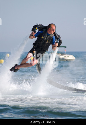 Jetlev, a personal flying machine. Flying, based on a water-propelled jetpack, near Marbella, Costa del Sol, Spain. Stock Photo