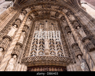 Ornate Carved Stone tympanum . The sculpture above the entrance to the Cathedral is intricately carved stone. Stock Photo