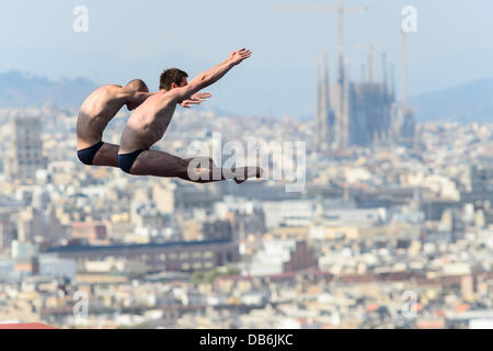 Barcelona, Spain. 21st July 2013: Belarus's Evgeny Karaliou and Vadim Kaptur jump off the platform the ten-meter synchro platform competition at the 15th FINA World Championships in Barcelona Stock Photo