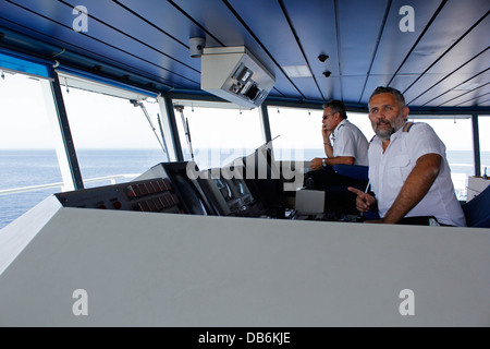 Captain on the bridge of a ferry crossing from Gozo to the sister island of Malta