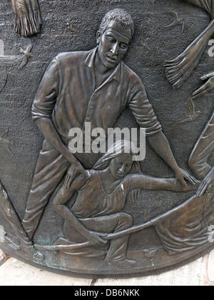 Detail from the 7 foot high circular bronze memorial in the Old Haymarket district of Liverpool