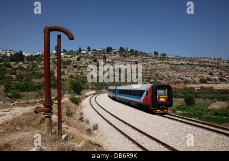 The passenger train from Jerusalem to Tel Aviv passing through the lands of the Palestinian village of Battir which is located west of Bethlehem south of Jerusalem with parts of its lands situated on the Israeli side of the Green Line. Stock Photo