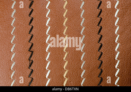 Closeup on a leather texture with a linear stitch. Stock Photo