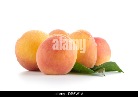 Sweet peaches with leafs on a white background Stock Photo