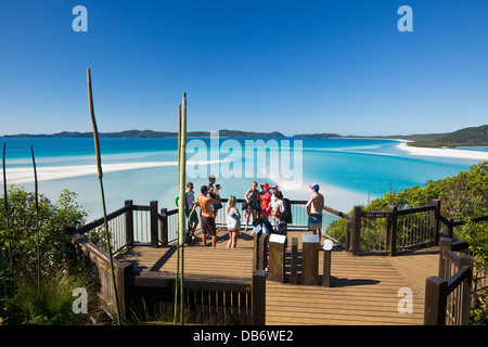 Tourists at the scenic lookout overlooking Hill Inlet and Whitehaven Beach. Whitsunday Island, Queensland, Australia Stock Photo