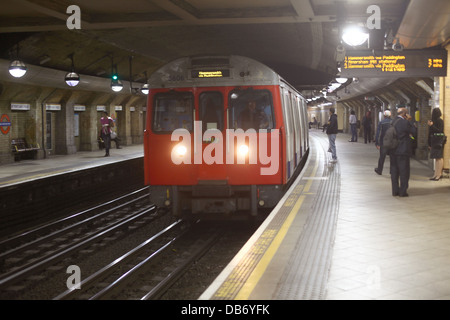 July 2013 - Older style of London Underground train entering a station. Stock Photo