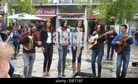 Image of a surprise busking performance by Irish pop group B*Witched in Temple Bar Square in Dublin city centre. Stock Photo