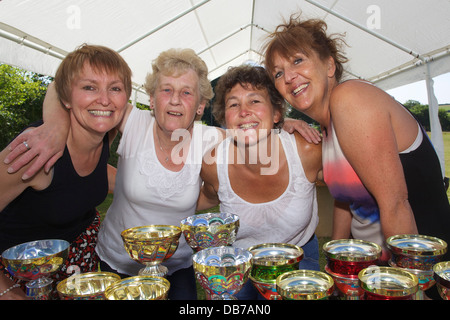 Celebrating the 2013 St Tudy Carnival are four members of the carnival committee Stock Photo