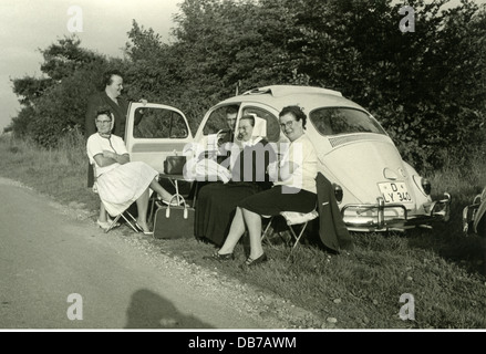 transport / transportation,car,vehicle variants,Volkswagen,VW 1200(VW beetle),with folding roof from 1962,rest on the roadside,four women and one man making break,Duesseldorf,Germany,circa 1963,excursion,outing,short trip,excursions,outings,short trips,Volkswagen Beetle,VW Type 1,Volkswagen Bug,car trip,have a picnic,picnicing,having a picnic,picniced,had a picnic,picnic,camp table,camp tables,provisional,rear-wheel drive,local recreation,recreation,relaxing,relax,silence,leisure time,free time,spare time,deaconess,car r,Additional-Rights-Clearences-Not Available Stock Photo