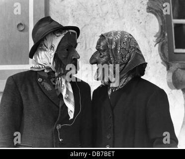 festivities, carnival at Partenkirchen, couple wearing wooden masks, Garmisch - Partenkirchen, 1956, Additional-Rights-Clearences-Not Available Stock Photo