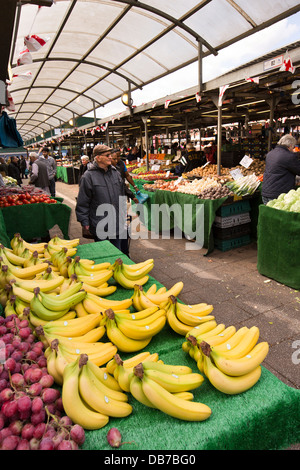 UK, England, Birmingham, Bullring, shoppers in traditional open fruit and vegetable market Stock Photo