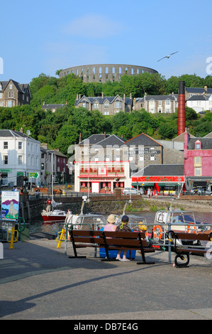 View over Oban harbour and up to McCaig's tower Stock Photo