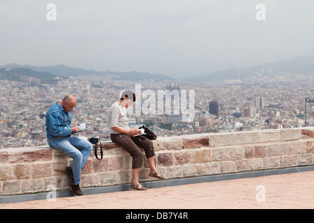 Tourists on Montjuic Castle overlooking Barcelona Stock Photo