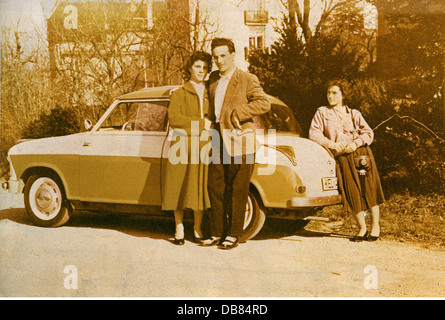 transport / transportation,car,vehicle variants,Lloyd LP 600,made by: Lloyd Motoren Werke GmbH,Bremen,family posing proudly in front of the car,Kehl,Baden-Wuerttemberg,Germany,1957,car owner,small car,19 horsepower,600 cubic centimetre,four-stroke engine,four-cycle engine,four-stroker,four-stroke engines,four cycle engines,post war period,post-war period,post-war years,post-war era,Lloyd automobiles,German car maker,belongs to the Borgward Group,bichrome lacquer,driver,drivers,cheap,inexpensive,low-cost,economic miracle,economi,Additional-Rights-Clearences-Not Available Stock Photo