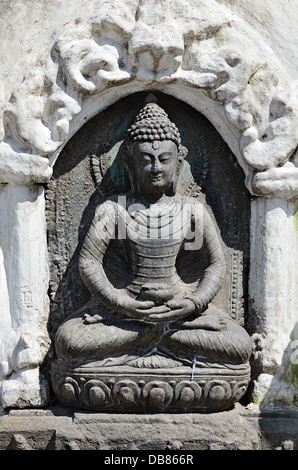 Stone Buddha statue from Swayambhunath Stupa Temple in Kathmandu, Nepal Stock Photo