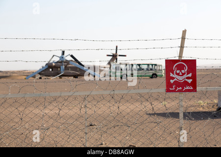 American services Operation Eagle Claw abandoned and wrecked helicopter and Iranian bus, Tabas, Iran Stock Photo