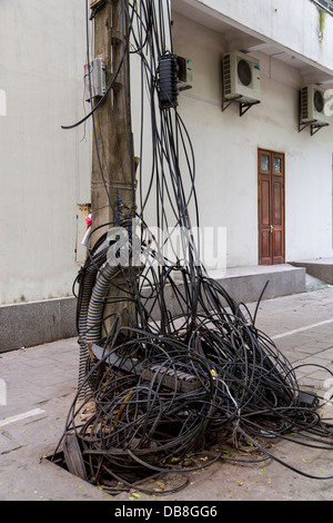 An 'electric power grid' on a pole in the Old Quarter of Hanoi, Vietnam, Asia. Stock Photo