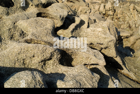 Coastal rocks carved by the sea and wind Stock Photo