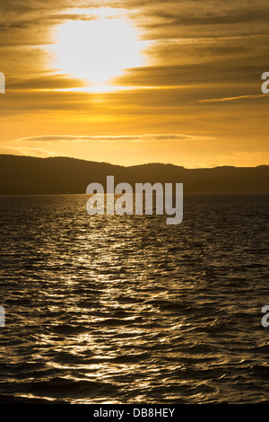 Beautiful view of the sun setting over the Firth of Tay, Scotland. Stock Photo