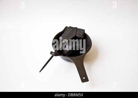 black comb and black bucket on white background Stock Photo