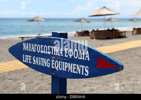 A sign for 'life saving equipments' on a beach at Lindos, Rhodes, Greece. Stock Photo
