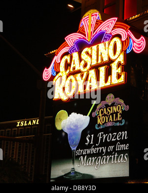 Night view electric billboard 'Frozen Strawberry or Lime Margaritas' below yellow pink neon sign, Casino Royale, Las Vegas Strip Stock Photo