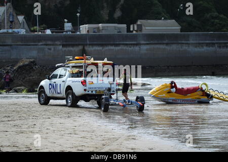 NEWQUAY,CORNWALL, ENGLAND - JULY 25: The Royal National Lifeboat Institution working on Towan Beach on July 25, 2012. The RNLI rescued 15 people on this day alone from Porth Beach. Credit:  Nicholas Burningham/Alamy Live News Stock Photo