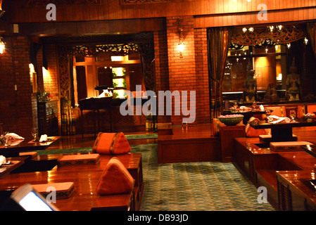 interior of traditional thai restaurant in Bangkok Sheraton hotel thailand table setting Stock Photo