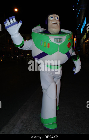 Dark sidewalk night flashlight portrait street entertainer dressed as Toy Story Buzz Lightyear, O'Shea's Casino, Las Vegas Strip Stock Photo
