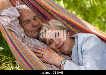 Closeup of senior Caucasian couple in hammock Stock Photo