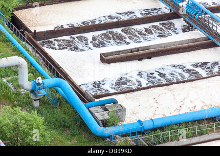 Blue pipelines with oxygen supply for water aeration in an industrial plant Stock Photo