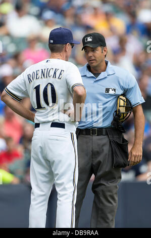 Home plate umpire James Hoye (92) explains a call to Texas Rangers ...