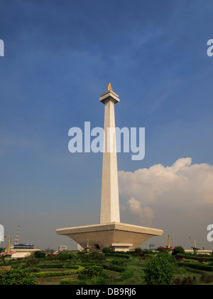 Jakarta, Indonesia: Merdeka Square View of National Monument column from garden pathway on sunny day Stock Photo