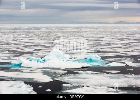 Rotten sea ice at over 80 degrees North off the north coast of Svalbard. Climate change is causing sea ice to retreat rapidly Stock Photo