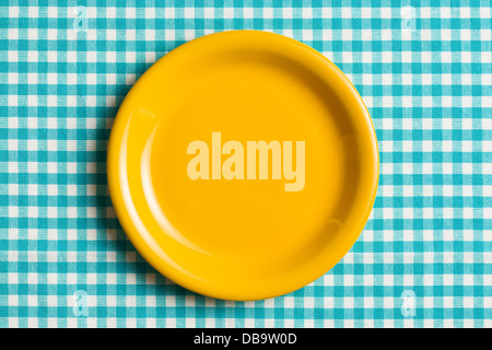 the empty plate on checkered tablecloth Stock Photo