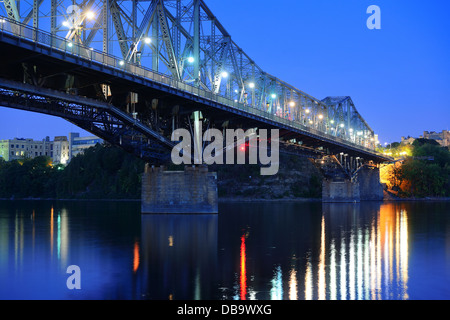 Ottawa at night over river with historical architecture. Stock Photo