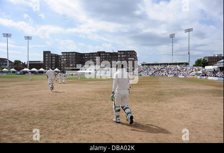 Hove UK 26 July 2013 -  The Australian batsmen walk out on to the pitch against Sussex at Hove County Ground today Stock Photo